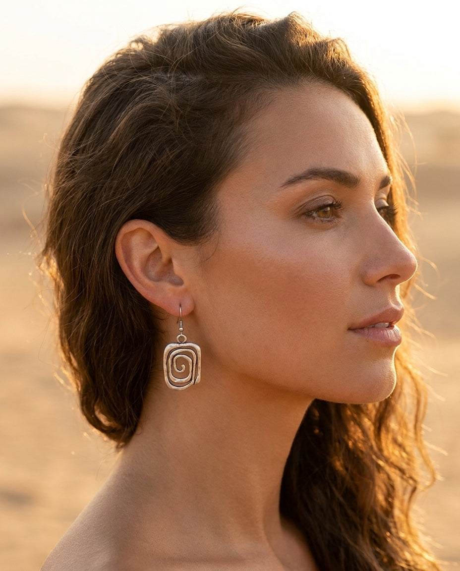 Model wearing Spiral Boho Earrings in Silver
